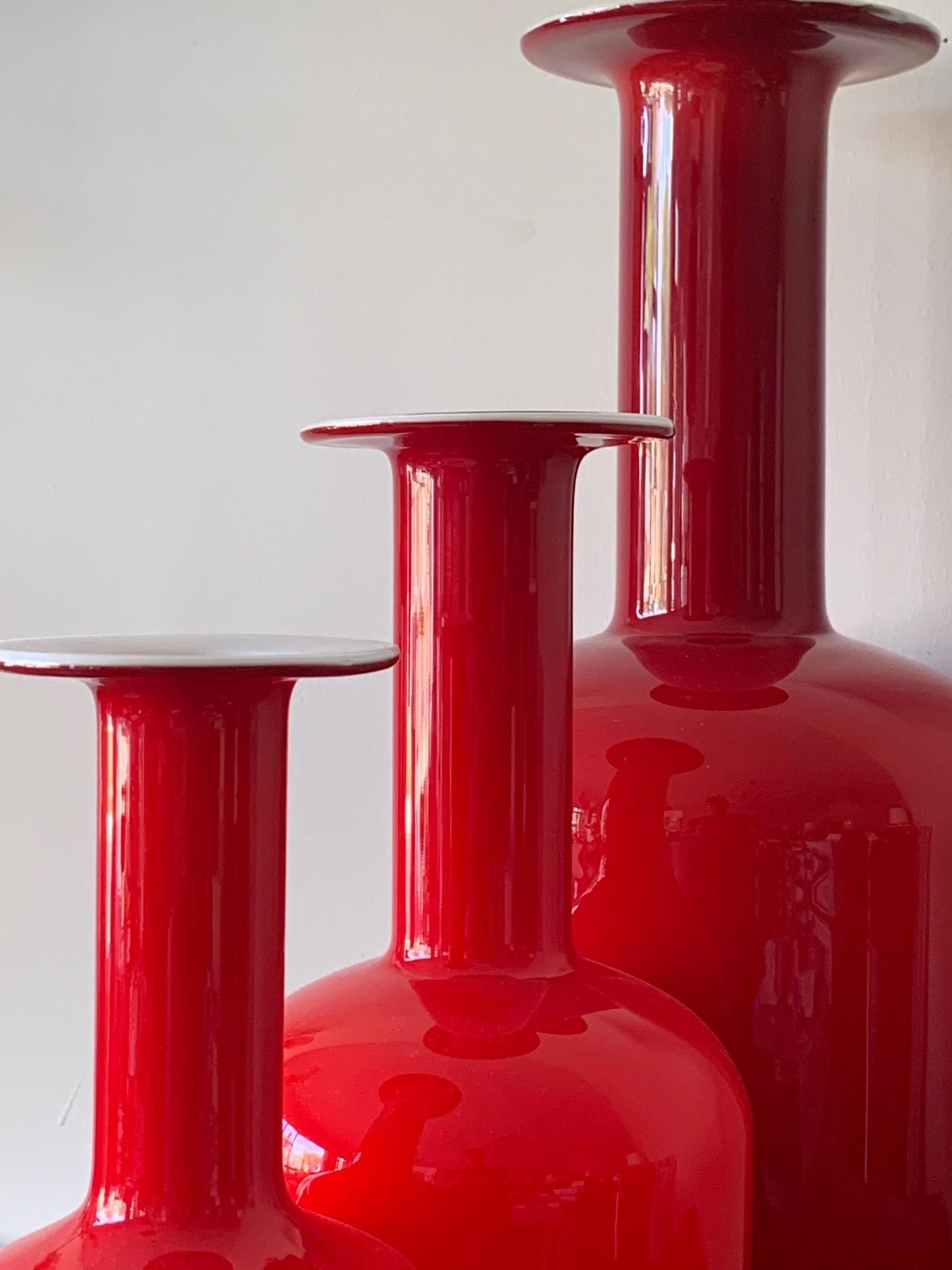 Frisman Vintage Group of Three Red Otto Bauer Holmegaard Bottles