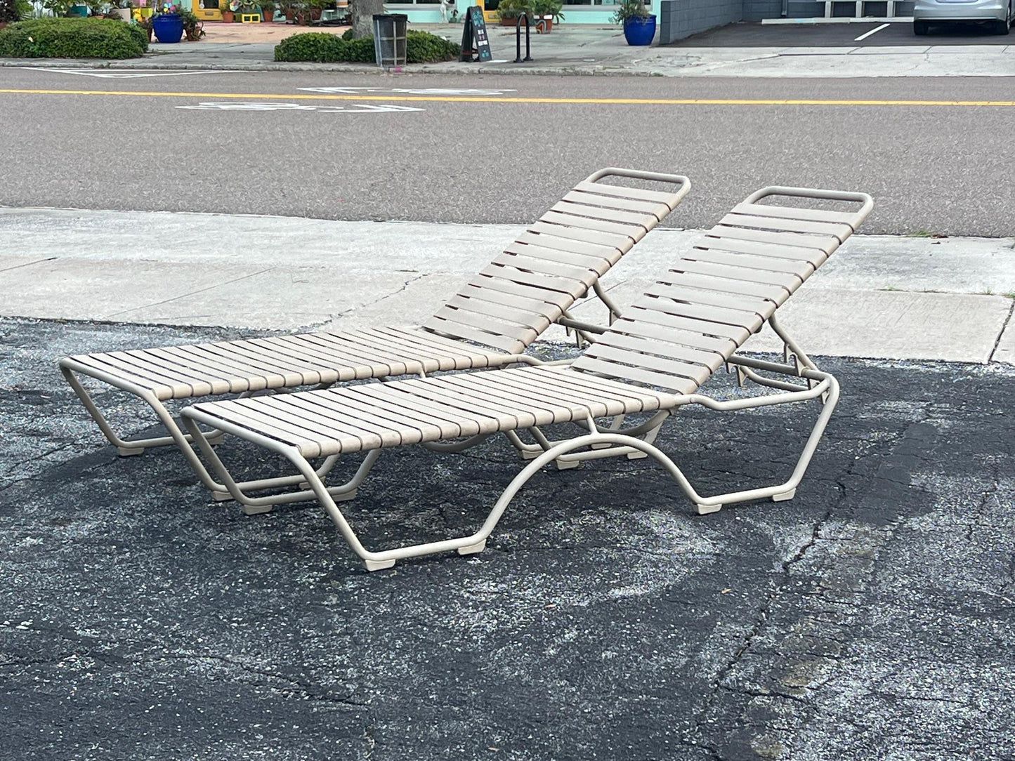 A Pair Of Aluminum Outdoor Chaises By Tropitone With Cushions