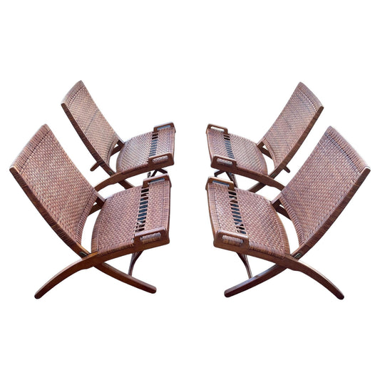 A Set Of Four Hans Wegner Folding Chairs