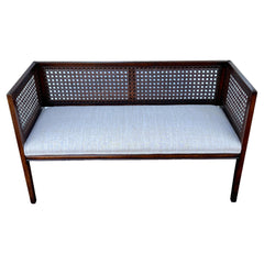 A Classic Upholstered Bench With Caned Back