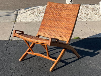 A Set Of Four Hans Wegner Folding Chairs