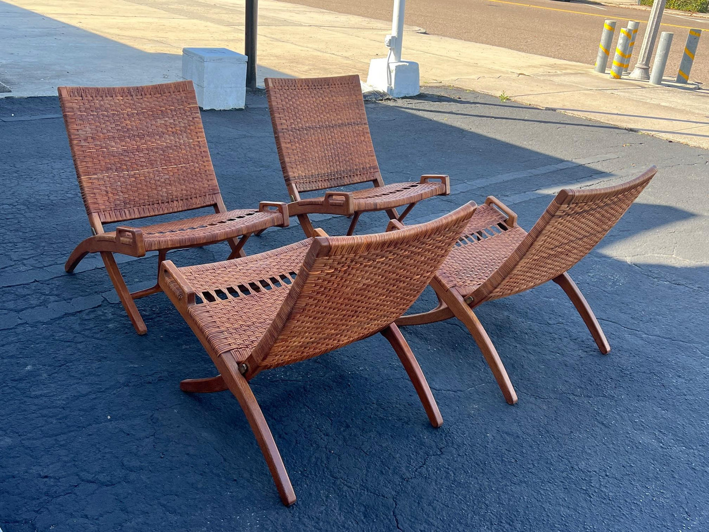 A Set Of Four Hans Wegner Folding Chairs