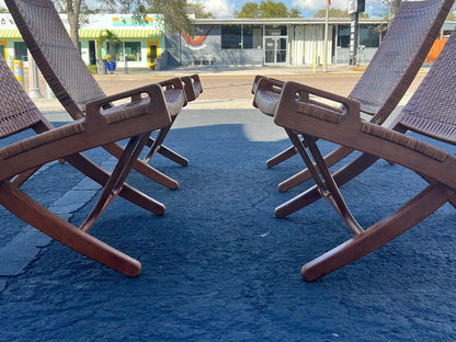 A Set Of Four Hans Wegner Folding Chairs