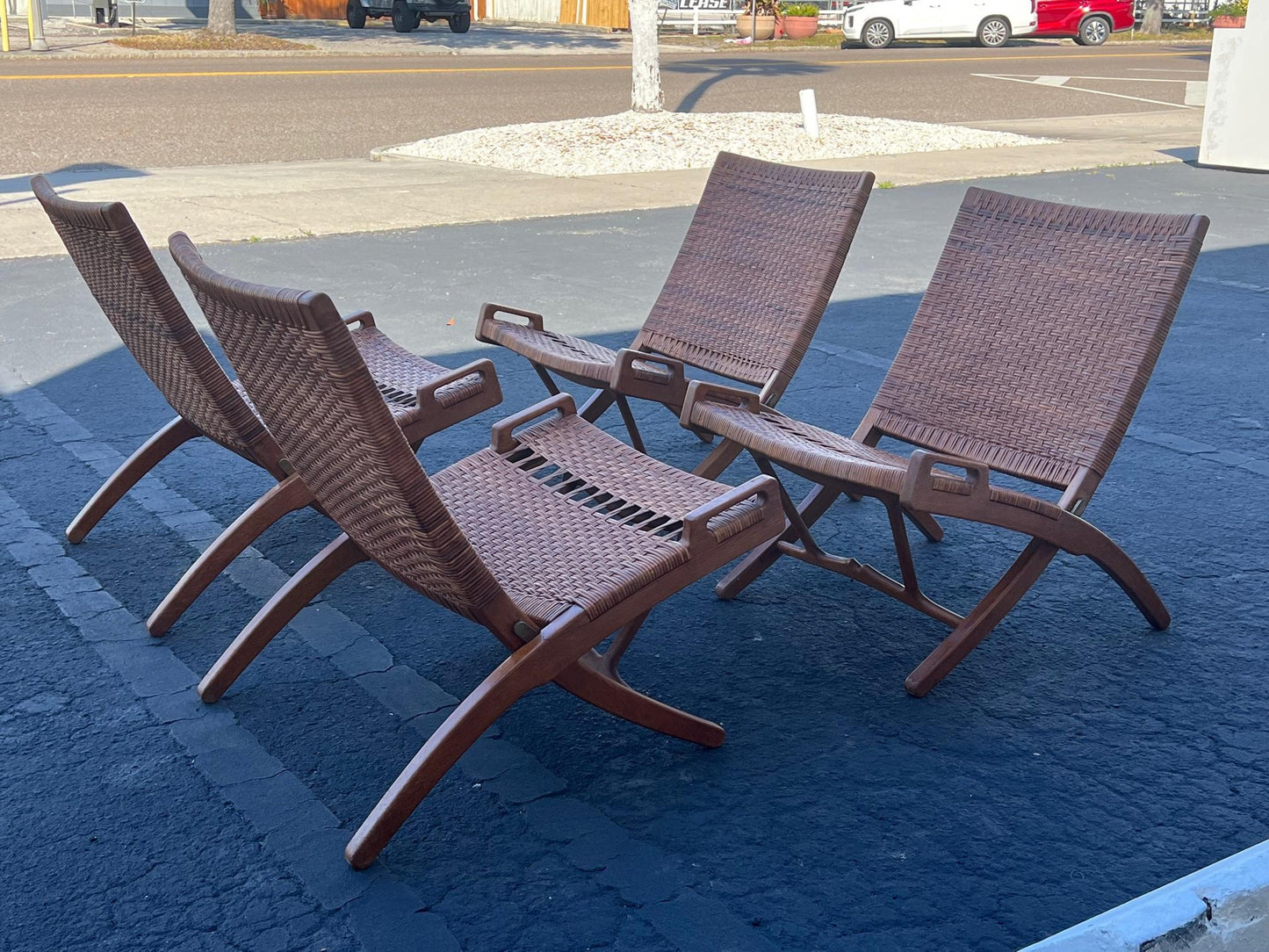 A Set Of Four Hans Wegner Folding Chairs