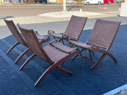 A Set Of Four Hans Wegner Folding Chairs