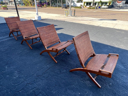 A Set Of Four Hans Wegner Folding Chairs