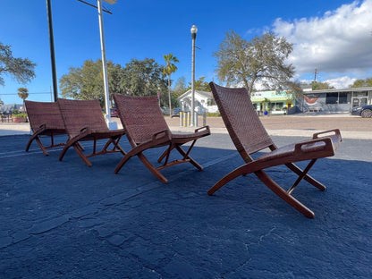 A Set Of Four Hans Wegner Folding Chairs