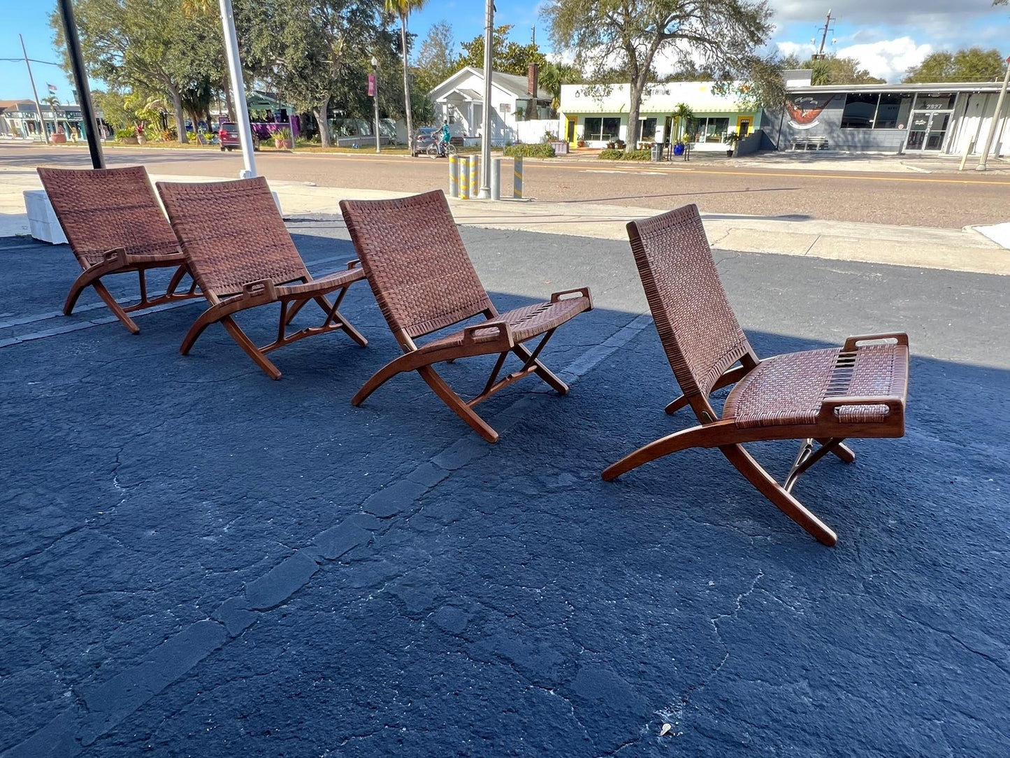 A Set Of Four Hans Wegner Folding Chairs