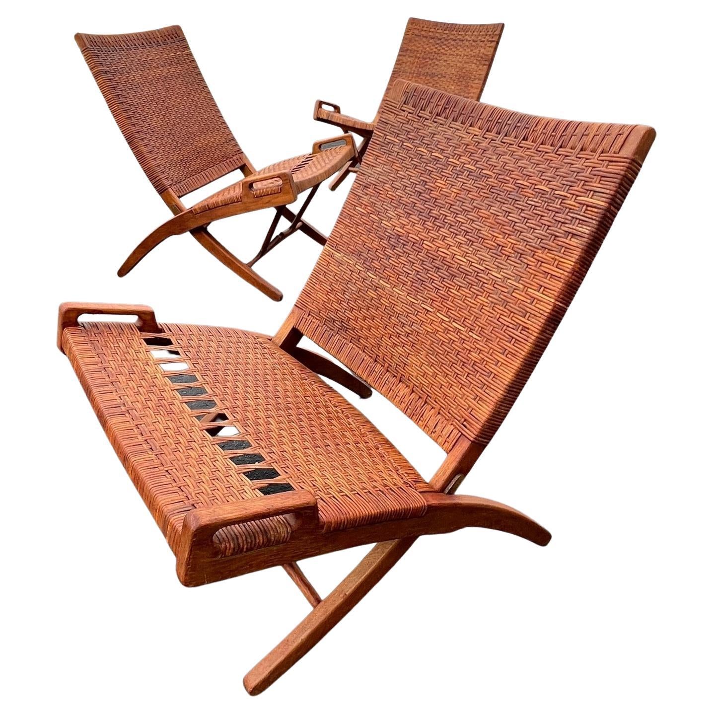 A Set Of Four Hans Wegner Folding Chairs