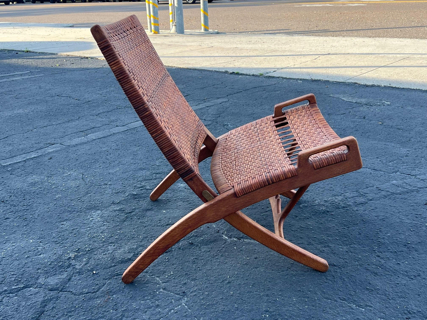 A Set Of Four Hans Wegner Folding Chairs