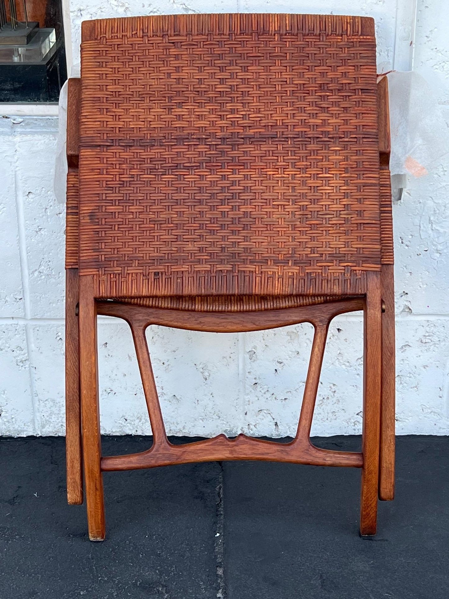 A Set Of Four Hans Wegner Folding Chairs